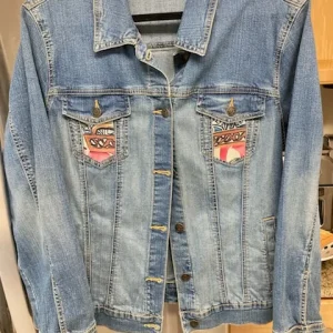 One of a kind, upcycled denim jacket.